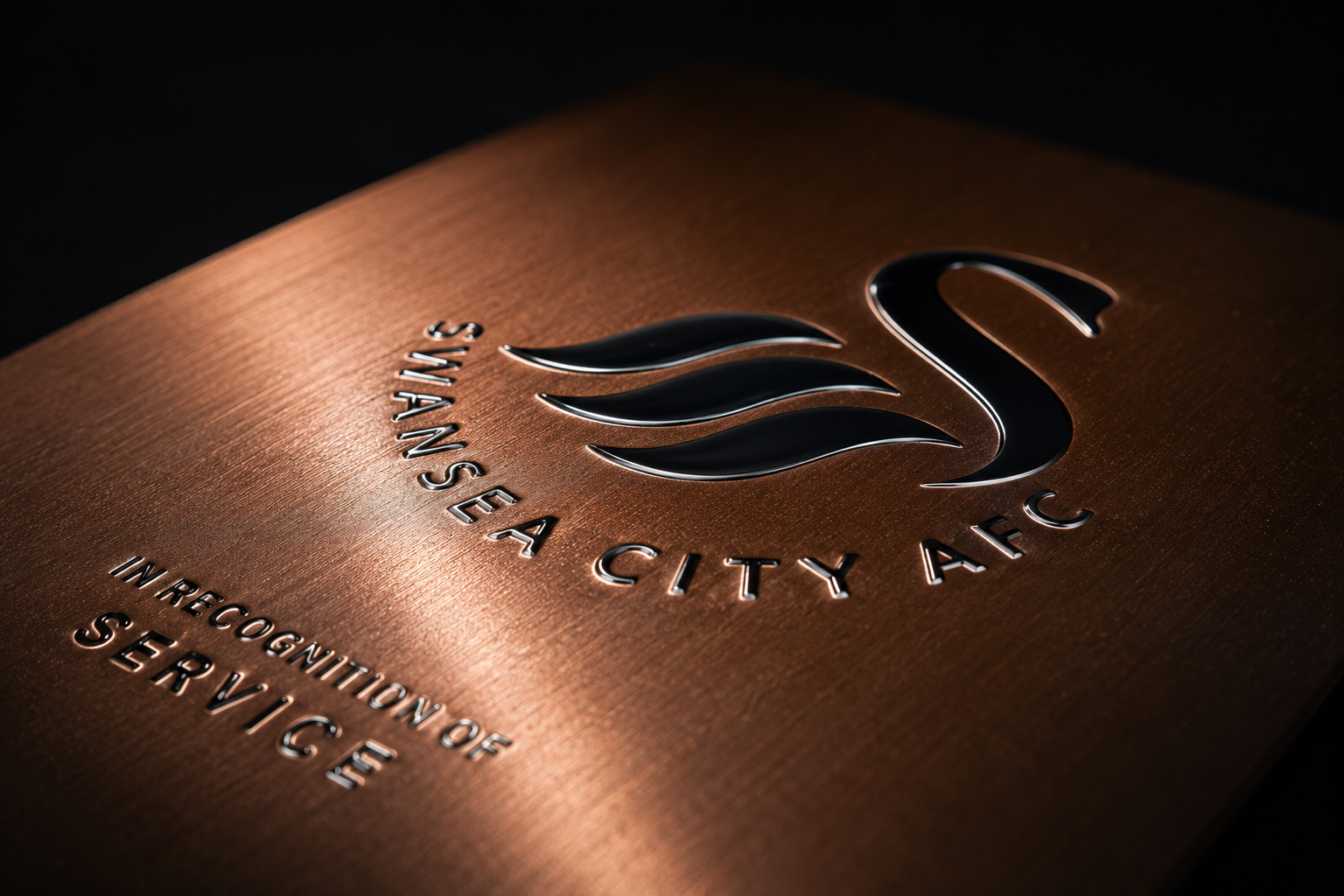 Close-up detail of raised UV print on a Legacy plaque, showing the 3D surface texture of the Swansea City AFC swan crest